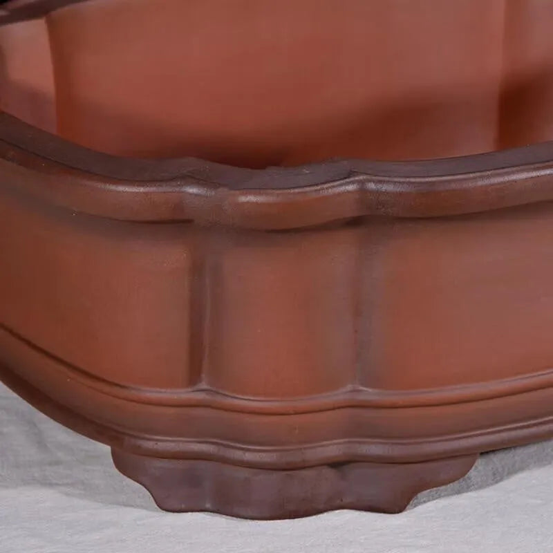 Large antique finish purple clay rectangular flowerpot with carved Chinese tree stump, pine, cypress, and fruit designs.