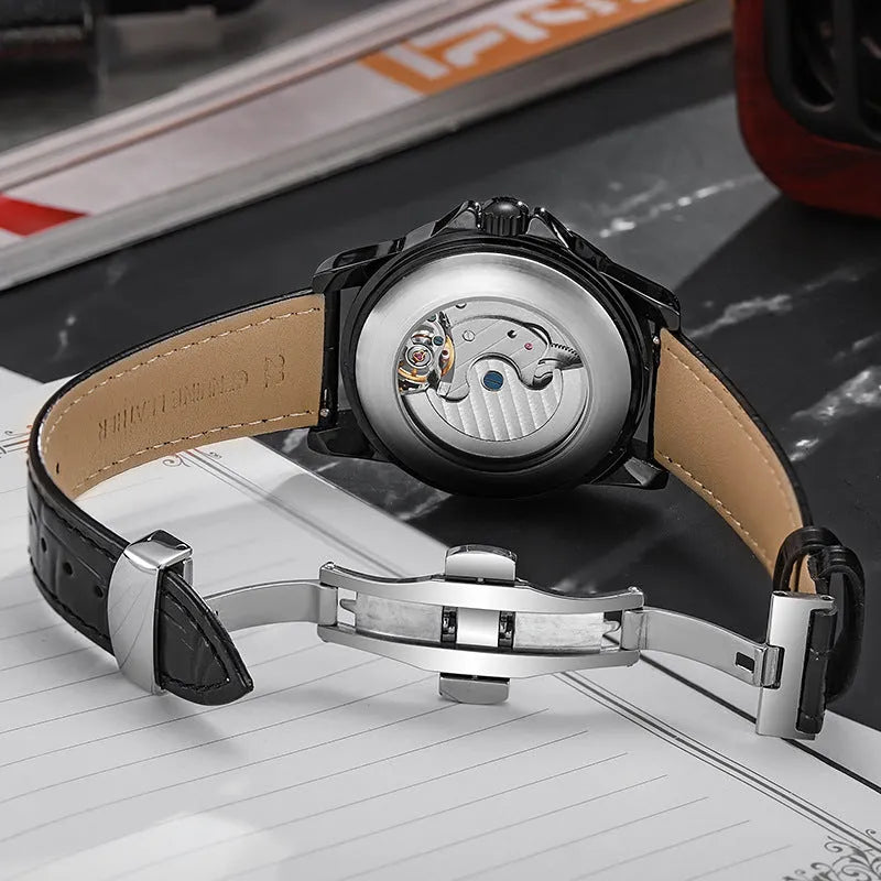 Automatic men's business watch with luminous hands on a steel bracelet.