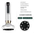 Green electric vacuum cupping massager with USB charger on a white background.