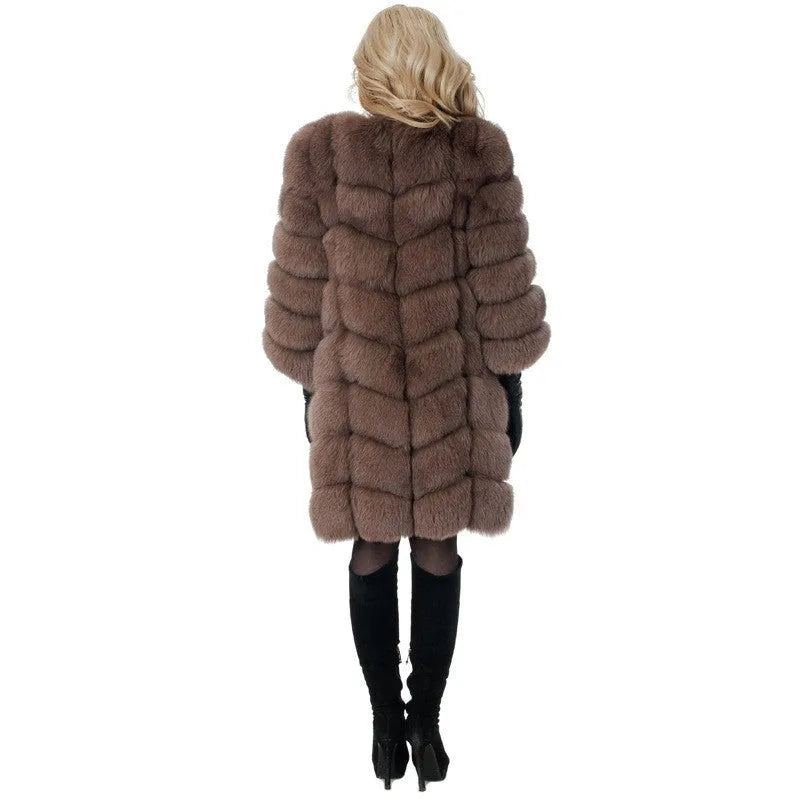 Women's long black artificial fur coat with regular sleeves, shown on a hanger.