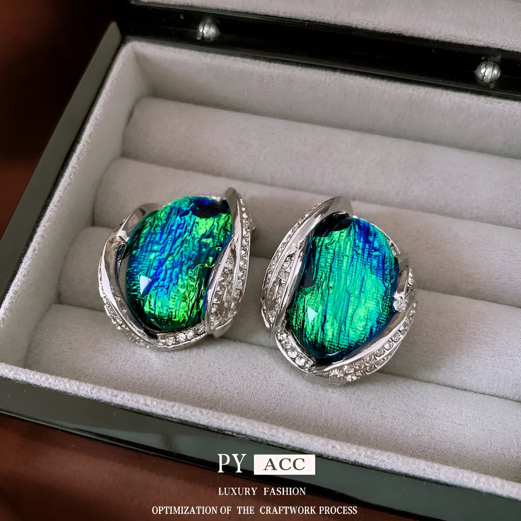 Silver resin stud earrings with rhinestone encrusting and irregular retro shape in silver needle green