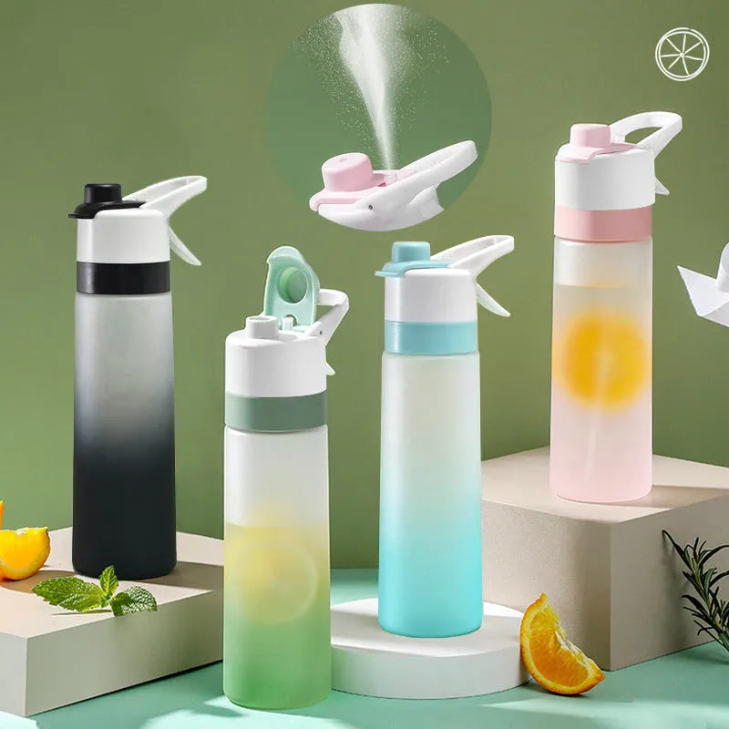 White 700ml plastic spray water bottle with handle strap and leakproof lid.
