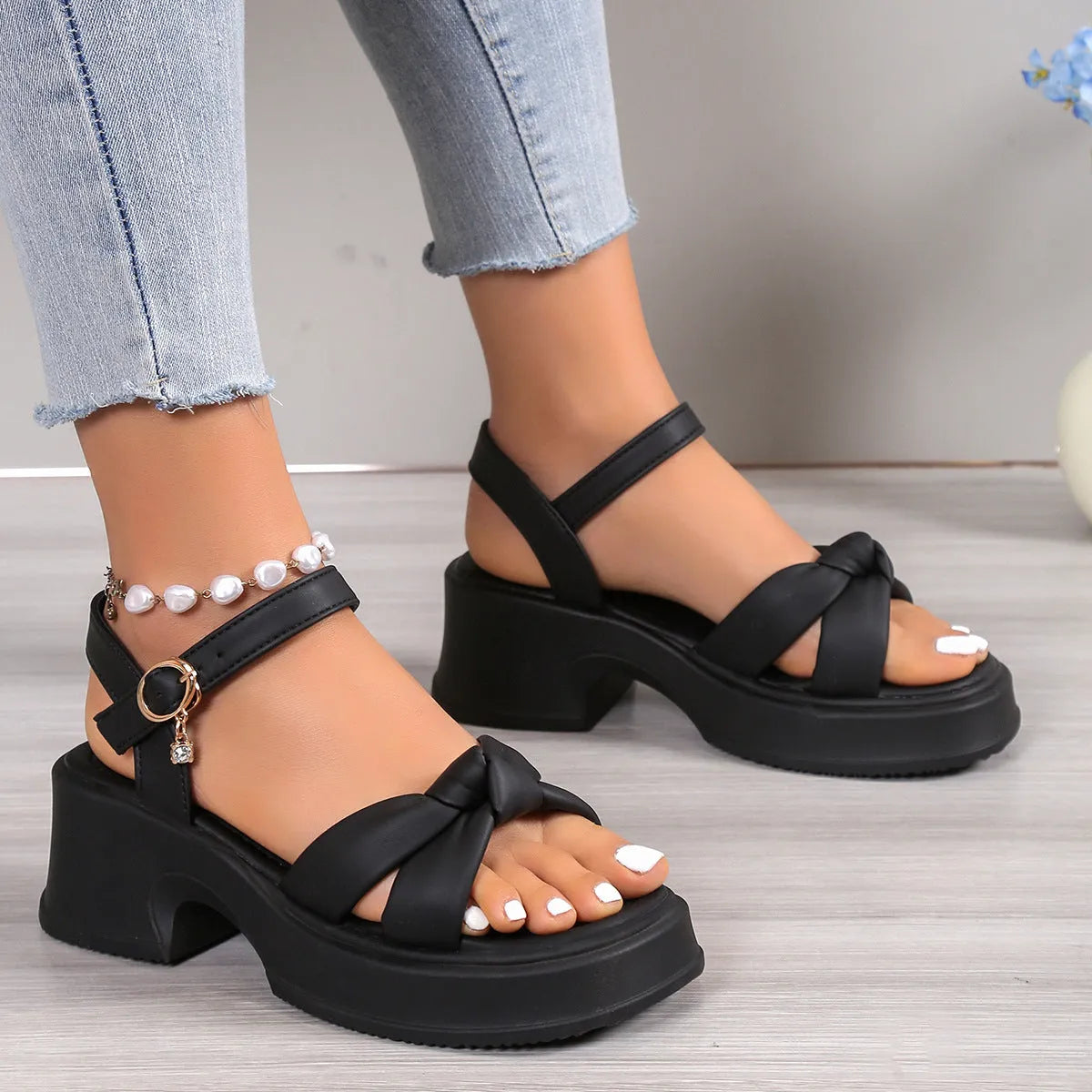 Black thick heel slippers with button fastening and rubber sole