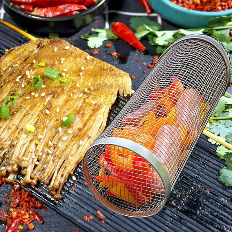 A cylindrical iron wire mesh rolling barbecue basket with a metal hook for handling.