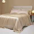 Aurora Blue 200 thread count Tencel duvet cover, fitted sheet, and pillowcases laid on a modern bed.