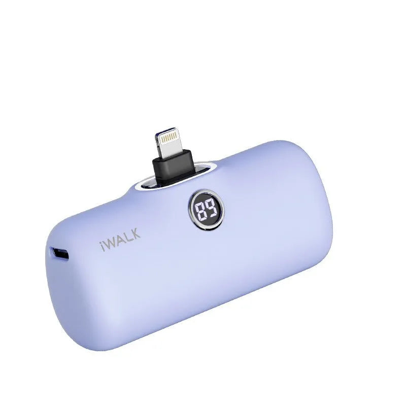 Small cylindrical lipstick tube power bank in purple colour showing digital battery percentage display