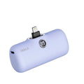 Small cylindrical lipstick tube power bank in purple colour showing digital battery percentage display