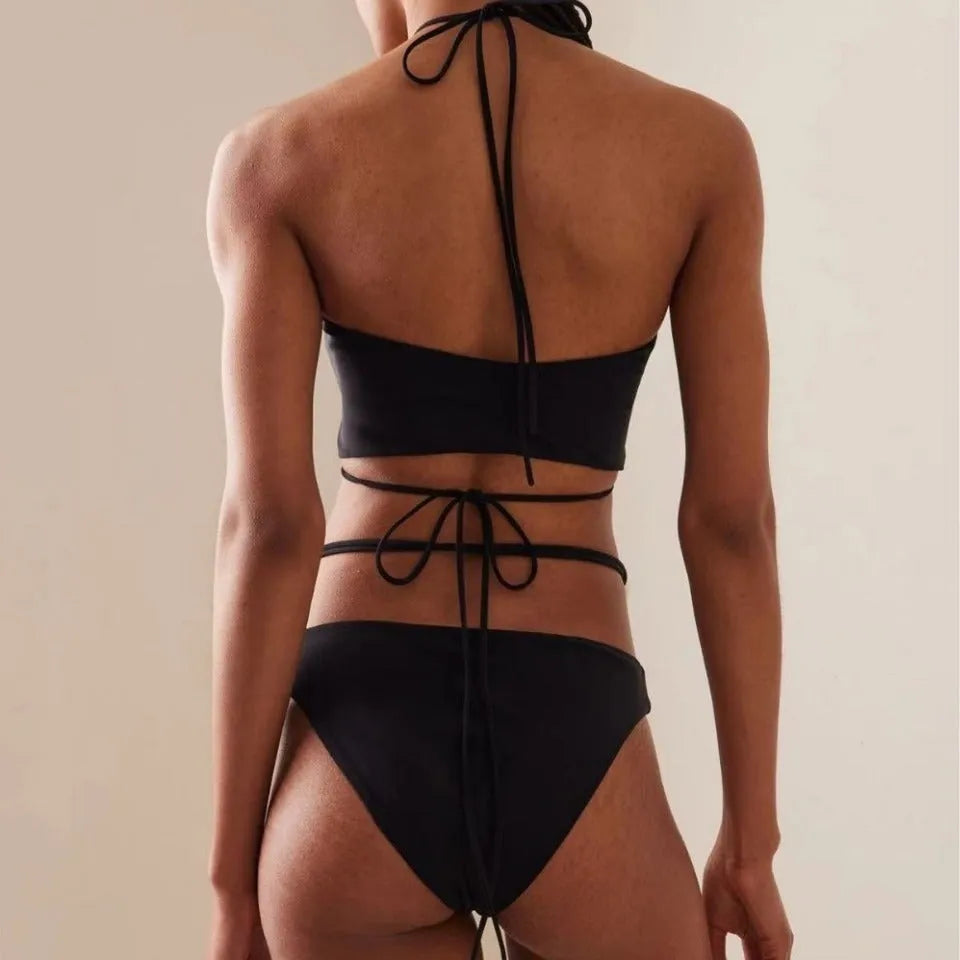 Black women's two-piece bikini swimsuit with lace-up front detail on the top.