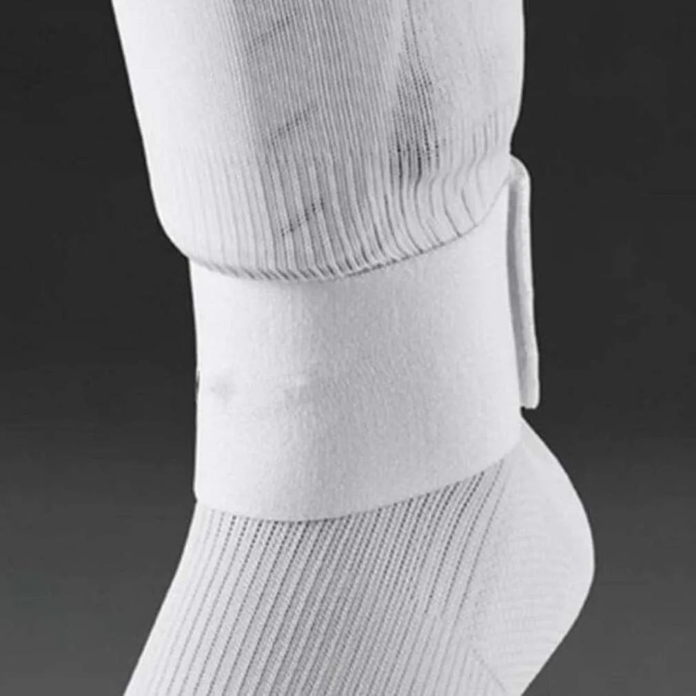 Red elastic rubber football shin guard tape belt laid flat, showing its length and width.