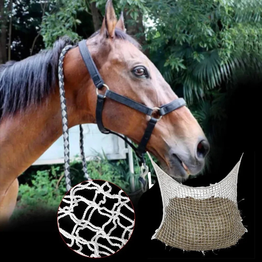 Woven polyethylene rope horse feeding bag in black hanging with hay visible through grid