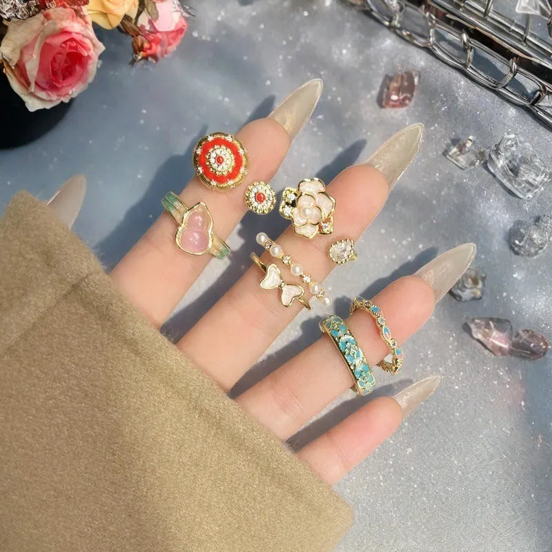 Copper adjustable vintage gourd ring with floral bow design and inlaid zircon stones.