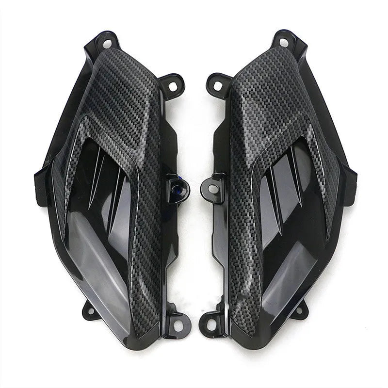 Pair of Yamaha NMAX scooter side lamp units with carbon fibre pattern and blue LED illumination