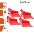 Four red triangular plastic car parking blocks with non-slip rubber surfaces