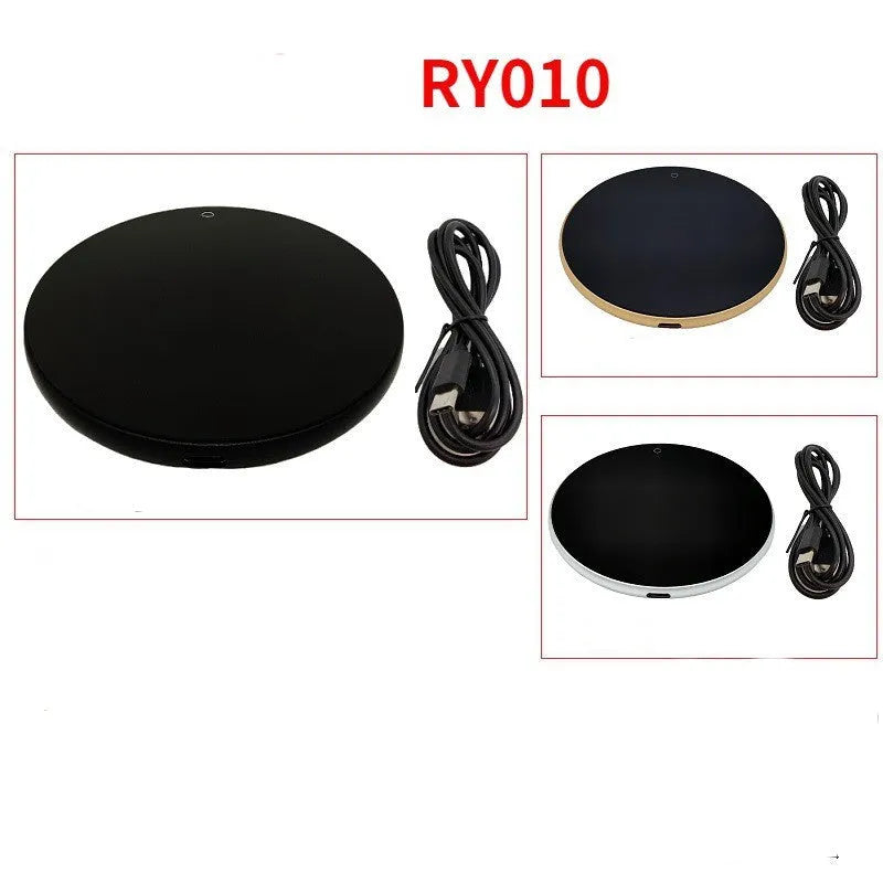 Black USB-powered beverage heating coaster with touch control and coloured LED lights on a wooden desk.