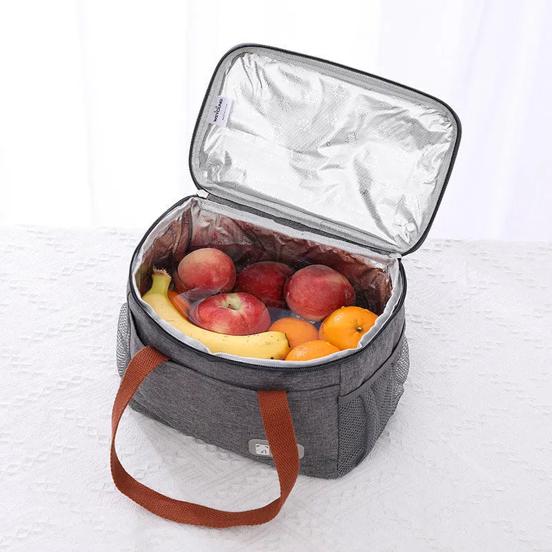 Grey insulated crossbody picnic bag with shoulder strap and 15 litre capacity.