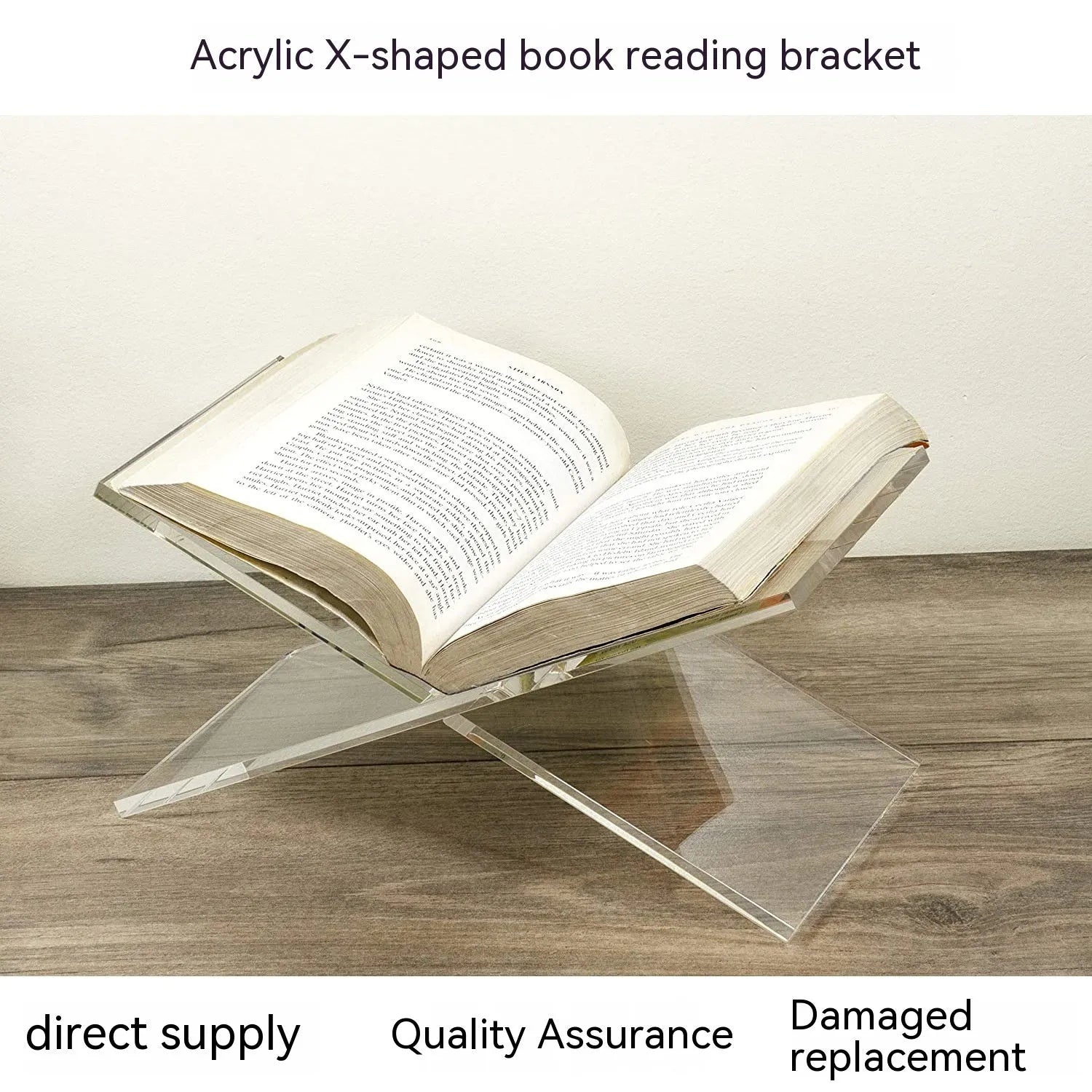Clear acrylic X-shaped book display rack holding several upright books on a desk