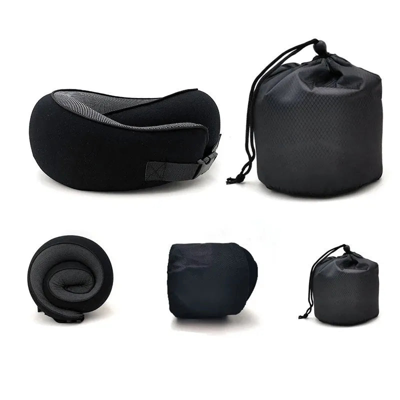 Navy blue U-shaped travel neck pillow rolled up next to its carry bag