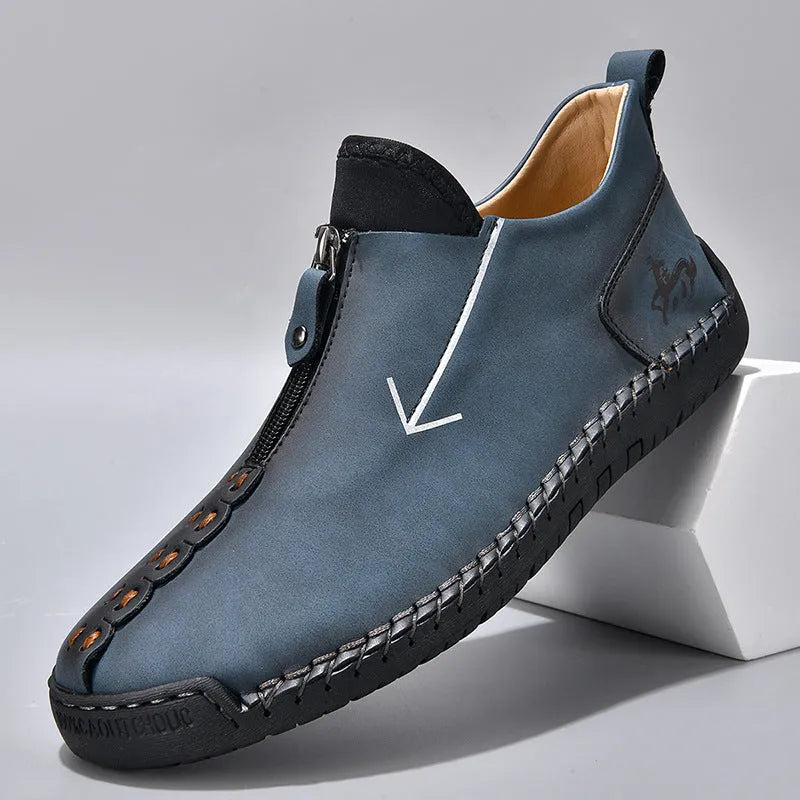 Men's brown front-zipper Martin boots with a round toe and mid-calf height on a rubber sole.