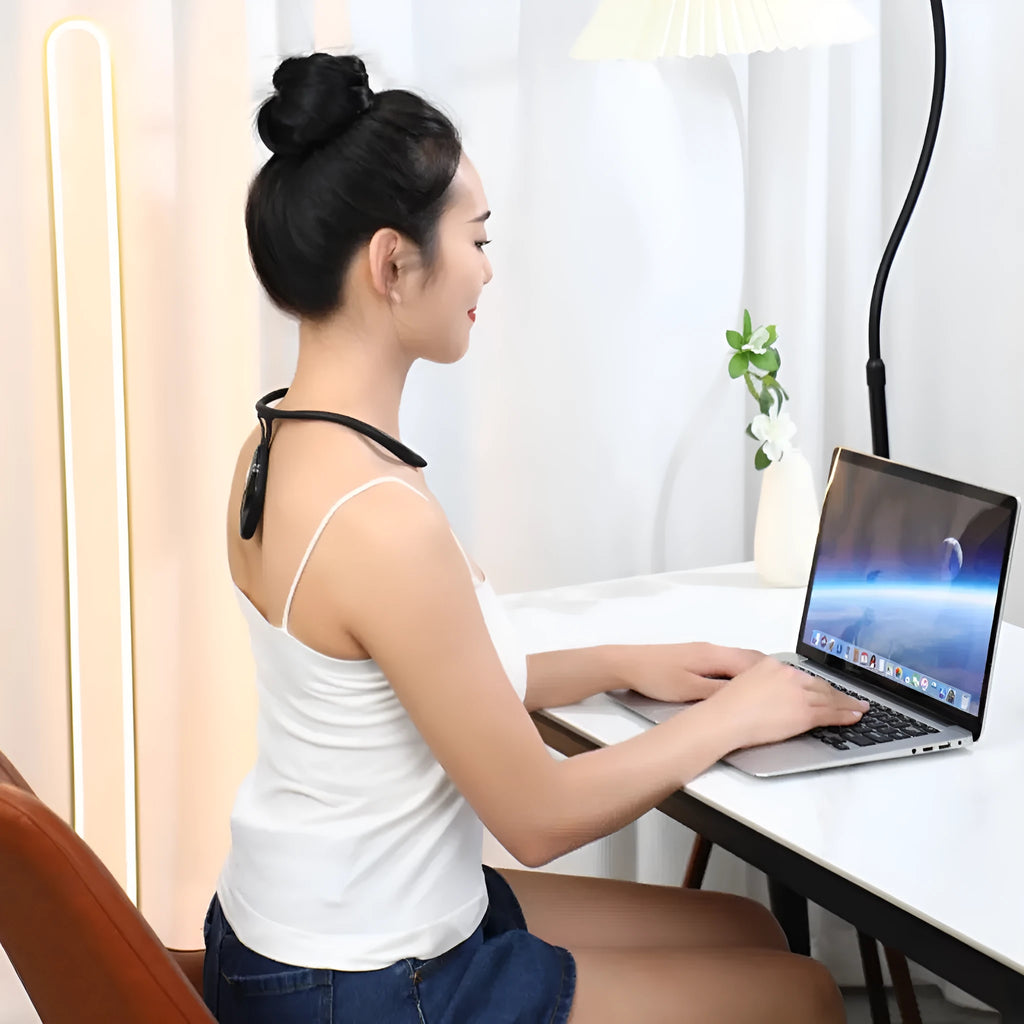 Children's smart LCD kyphotone posture corrector in black and orange with USB charging