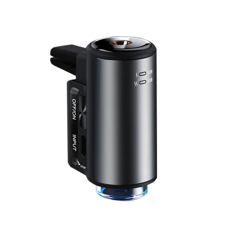 Smart car aroma diffuser clipped onto car air vent in obsidian black colour with essential oil bottles