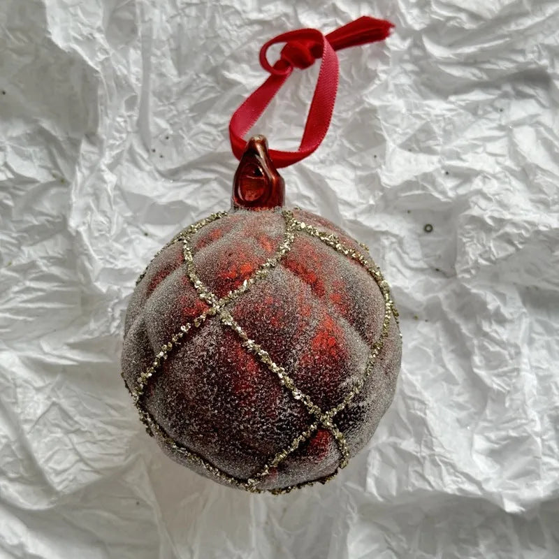 Handmade glass Christmas bauble 8cm diameter in green on branch