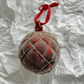 Handmade glass Christmas bauble 8cm diameter in green on branch