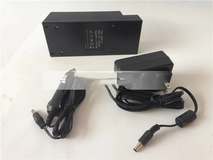 GKL112 compact white 220V car charger with UK plug on a car dashboard