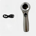 Illuminated black magnifying glass with optical glass lens for jewellery and stamp appraisal on a table.