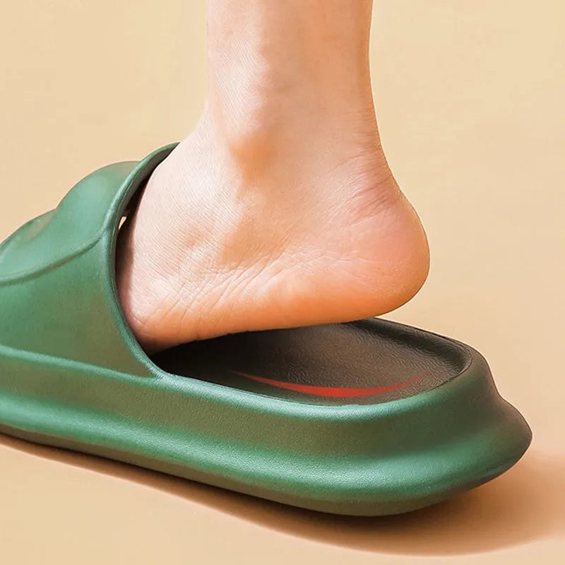 Pair of white EVA flip-flop slippers with a thick, textured sole on a tiled floor.