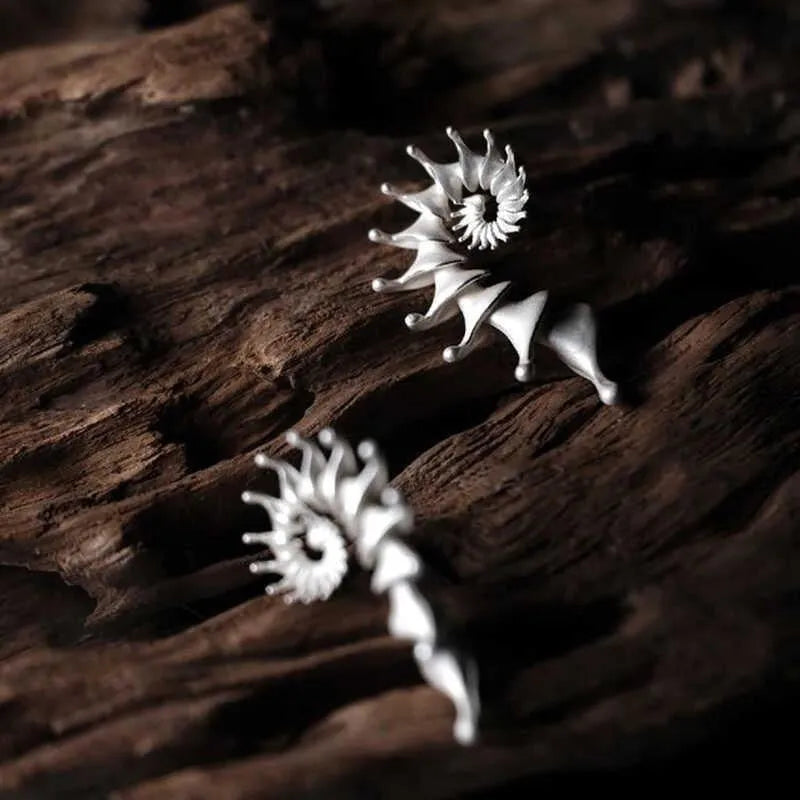 Three-dimensional matte conch stud earrings in alloy with irregular shape