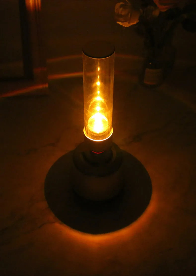 White silver candlelight Bluetooth speaker night light with modern design and push-button controls.