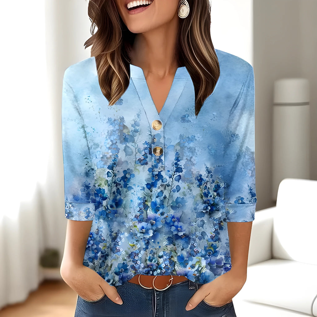 Women's loose-fit grey V-neck t-shirt with a white 3D geometric pattern print on the front.