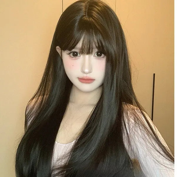 Dark brown long straight synthetic wig with bangs on a wig stand