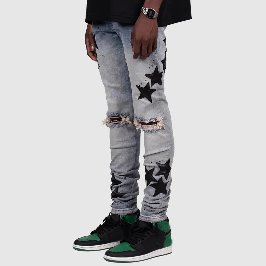 Men's slim stretch blue jeans with embroidery detail on denim fabric.
