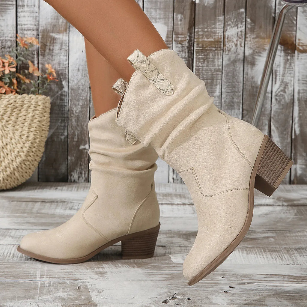 Women's suede mid-calf boots with a block heel and leather stitching details in lotus root colour.