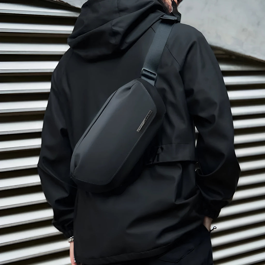 Black men's Oxford cloth crossbody messenger bag with a one-shoulder strap.
