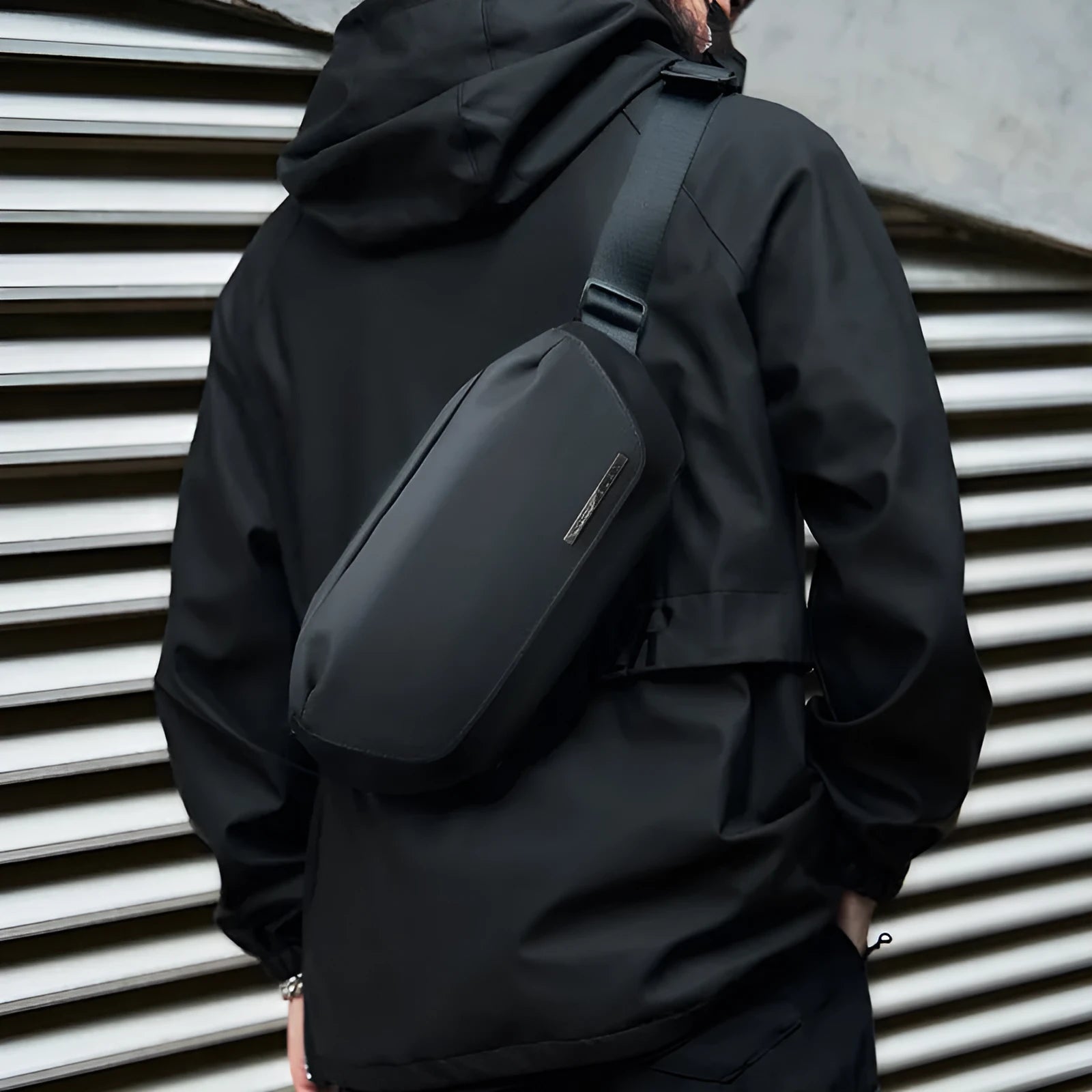 Black men's Oxford cloth crossbody messenger bag with a one-shoulder strap.
