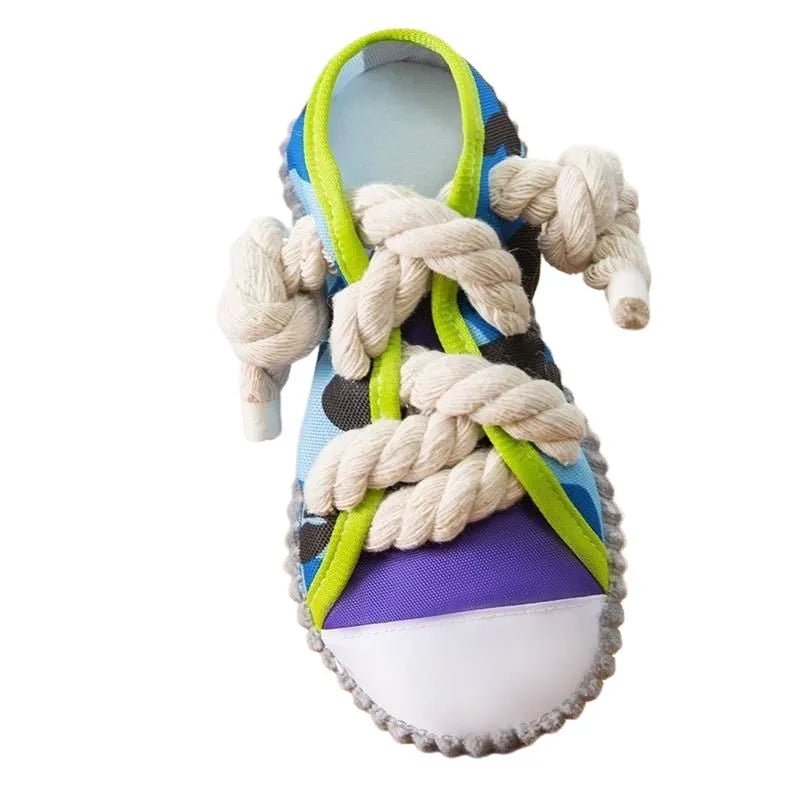 Grey and white dog toy slipper with black laces, blue sole, and a bell on the side