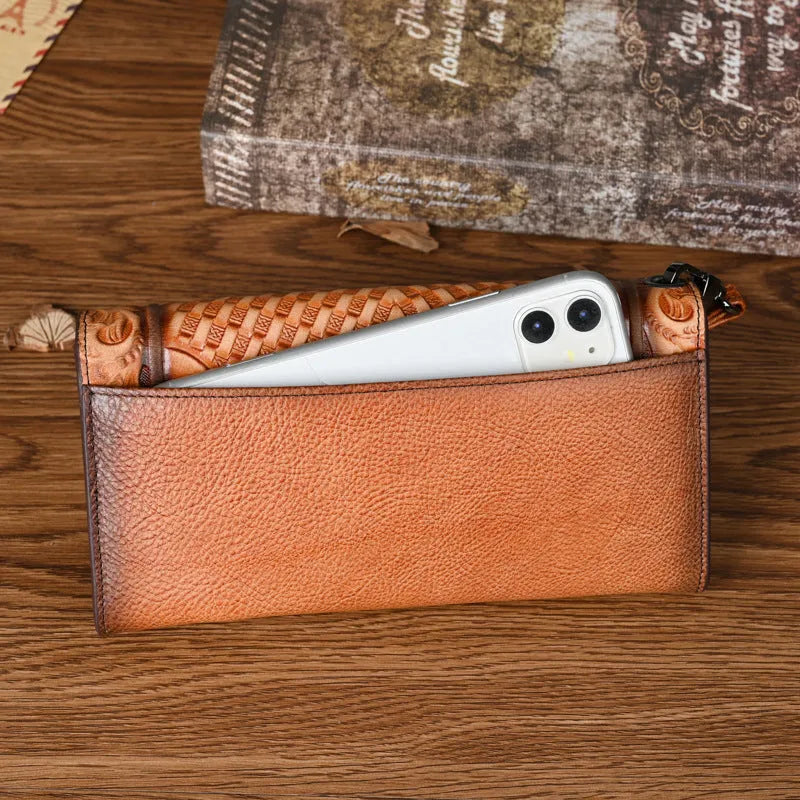 Retro brown tri-fold women's leather wallet with an embossed floral pattern, shown open to reveal compartments.