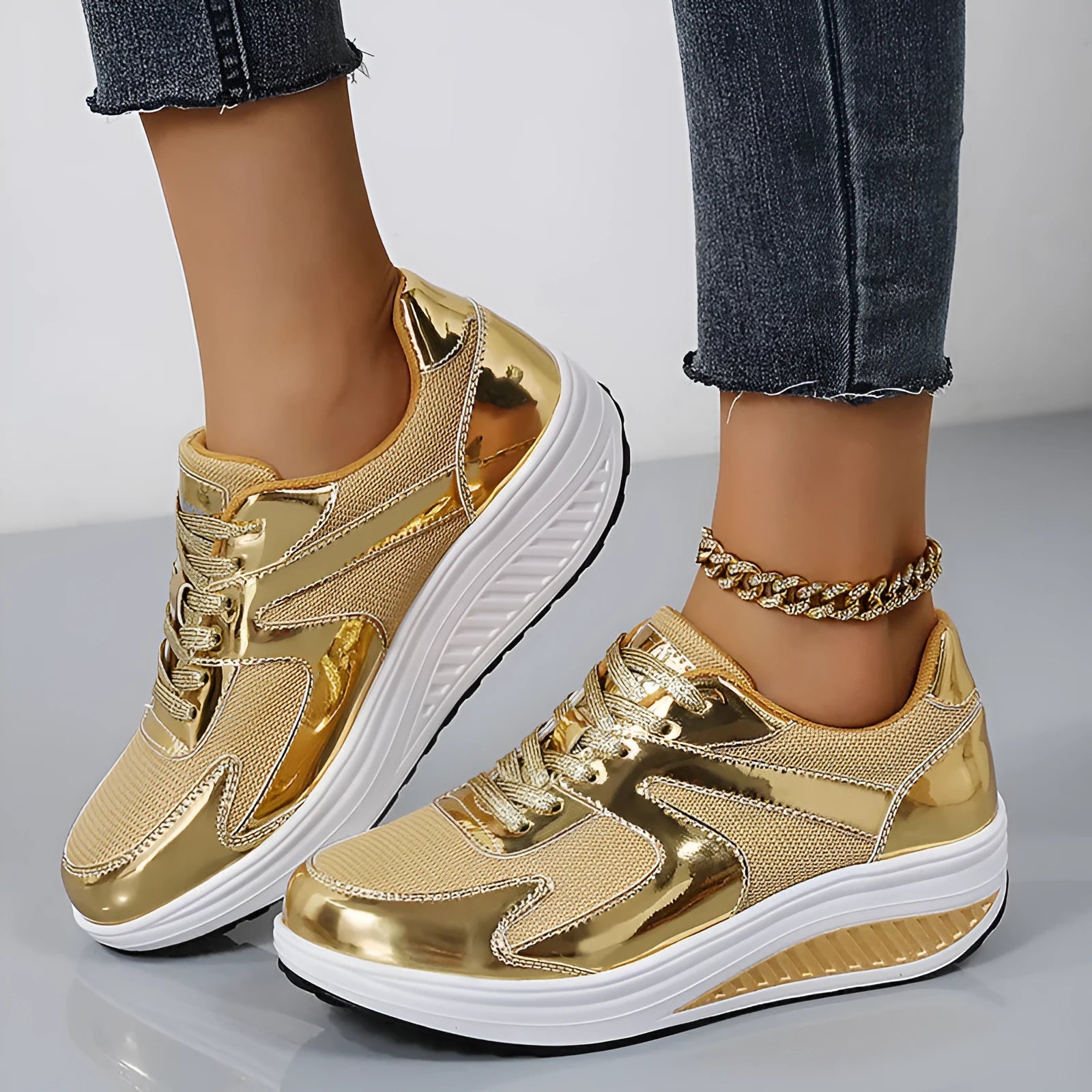 Women's gold mesh platform trainers with cross strap and mid heel