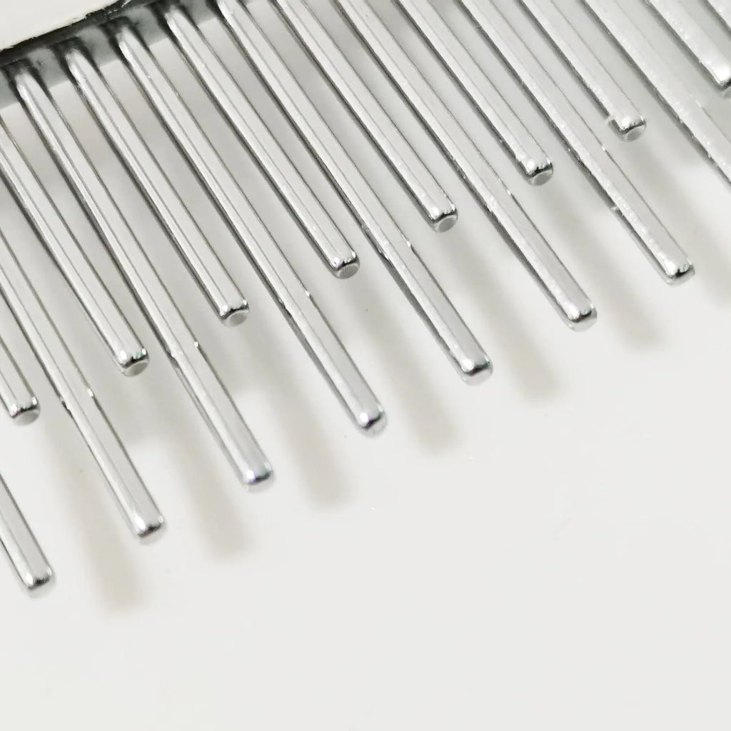 Red handled pet grooming comb with long and short stainless steel pin teeth for dematting.