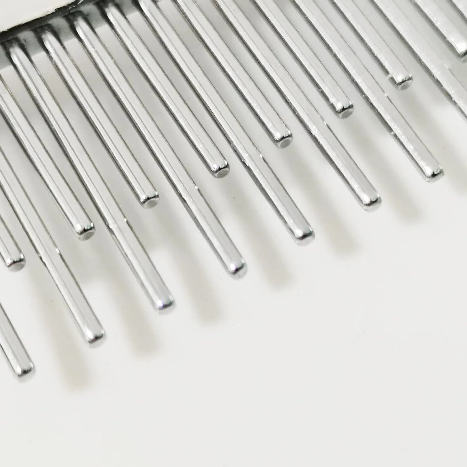 Red handled pet grooming comb with long and short stainless steel pin teeth for dematting.