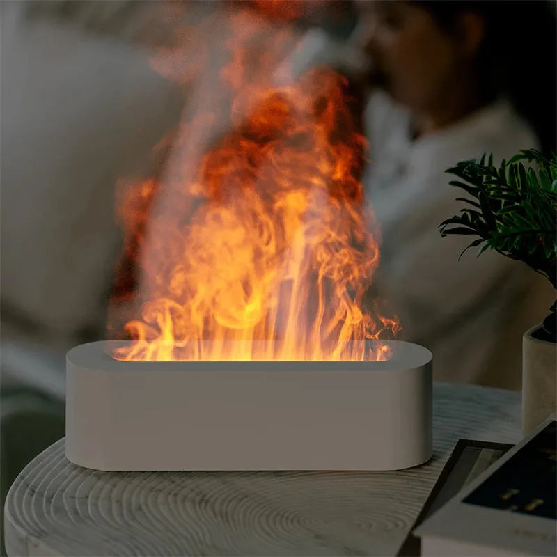 White square DQ709 flame aroma diffuser humidifier with glowing orange flame effect and water mist.