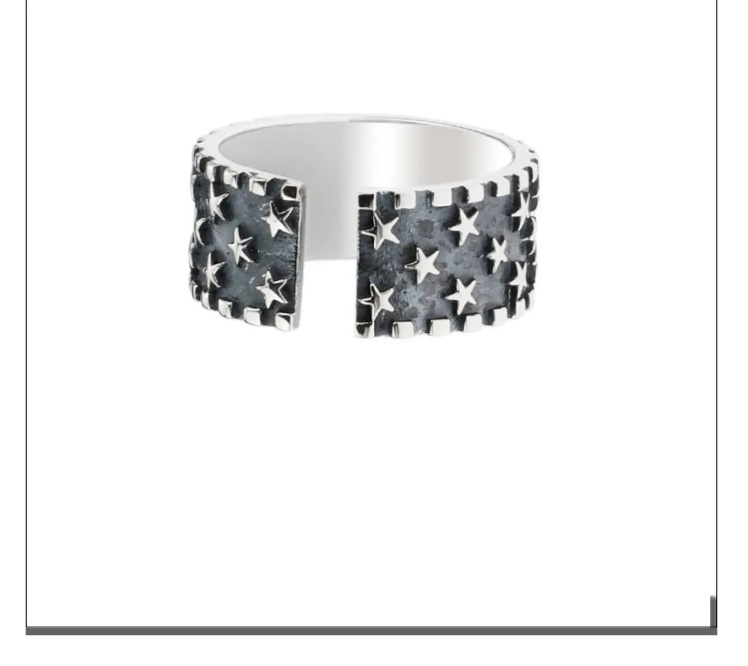 Adjustable sterling silver ring with a geometric pattern of five-pointed stars on the band.