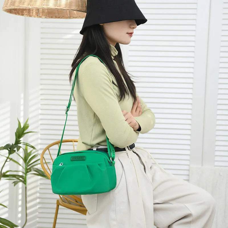 Pleated Oxford cloth shoulder messenger bag in horizontal square shape with cross-body strap