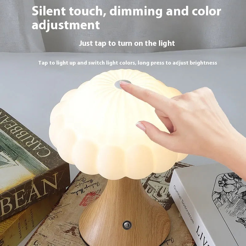 Mushroom-shaped touch control table lamp with USB charging port in wood grain finish.