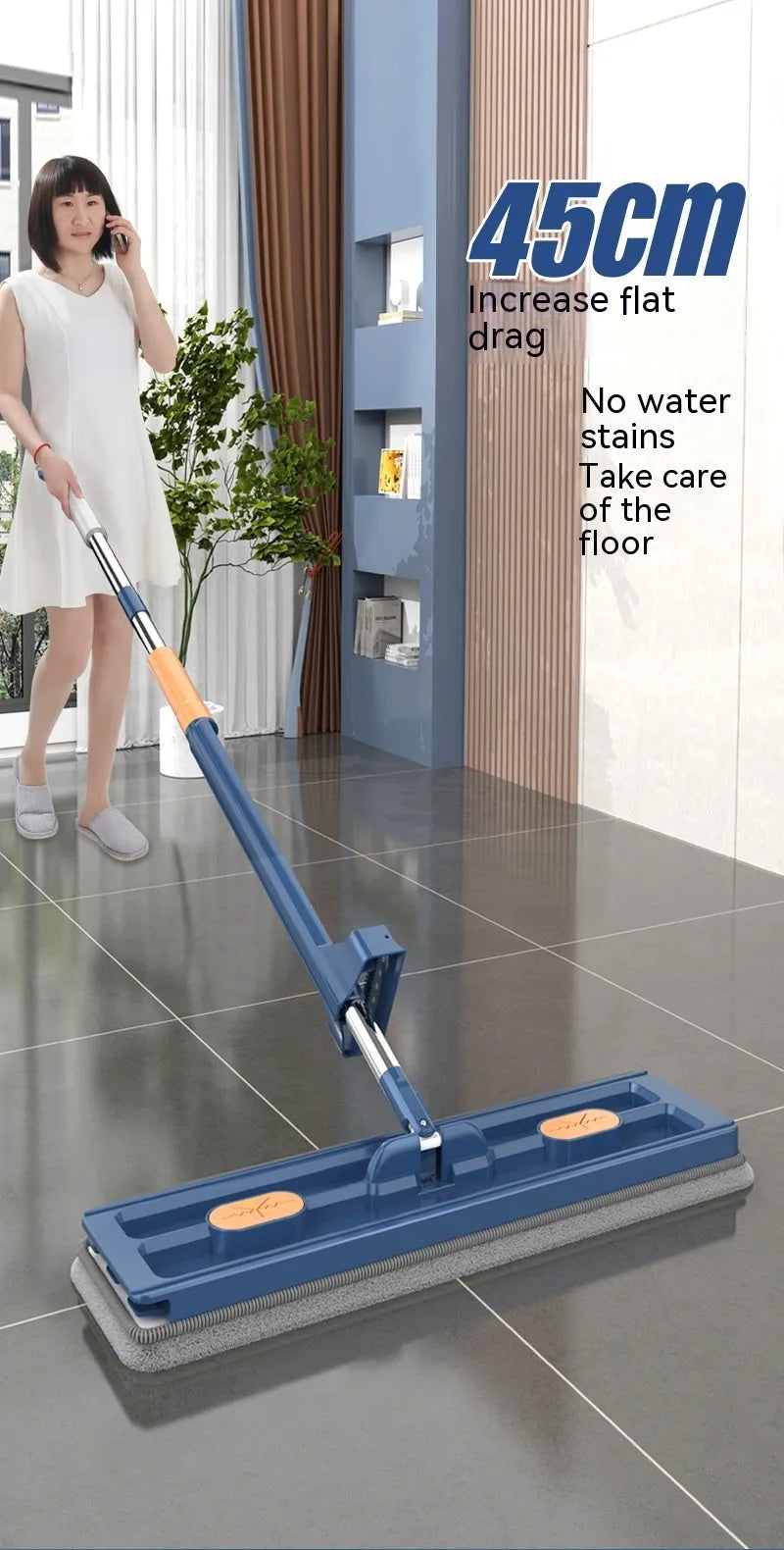 Large flat mop with blue cloths on stainless steel handle showing 360 degree rotating head mechanism