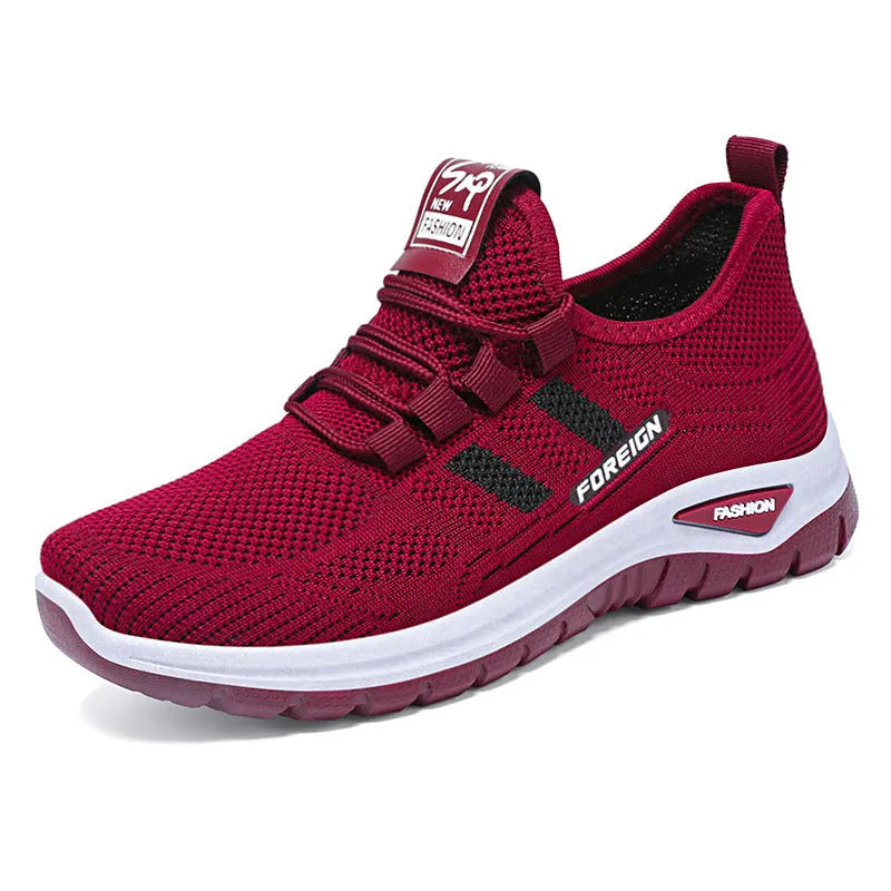 Low-top casual shoes with breathable mesh upper and flat PVC sole in black, grey, purple, or red.
