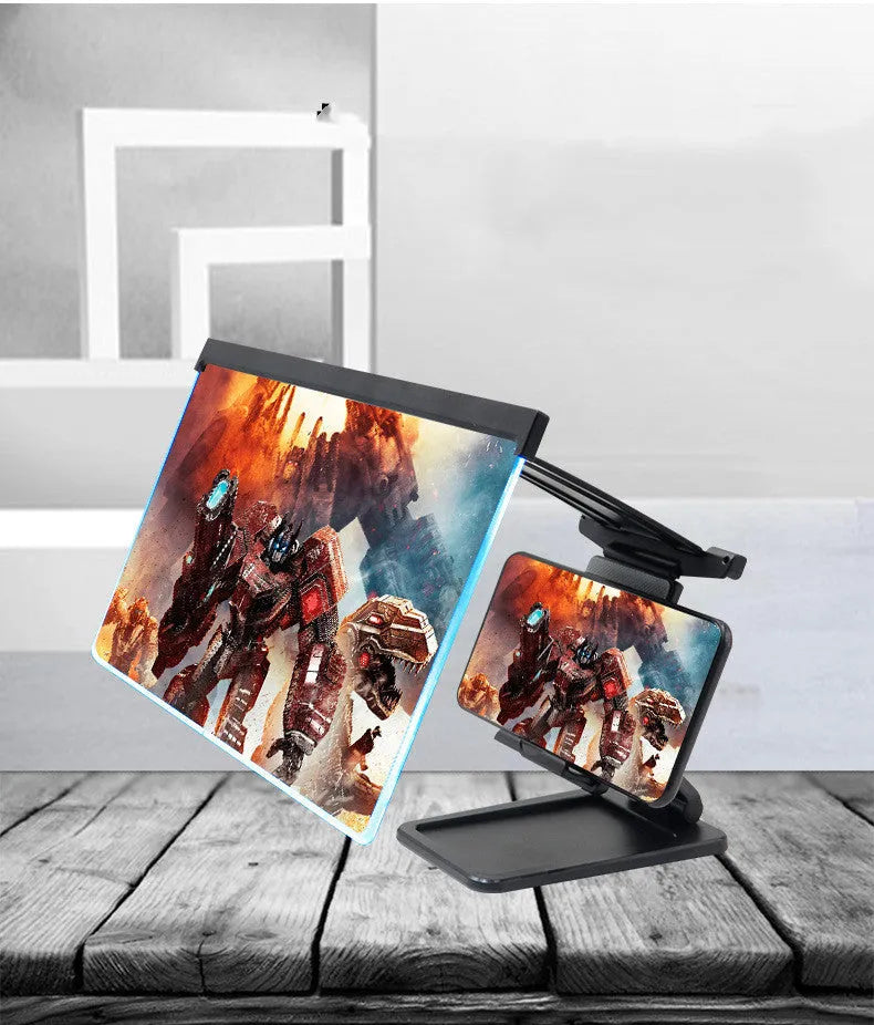 Black foldable mobile phone screen magnifier with detachable shading holder on a desktop.