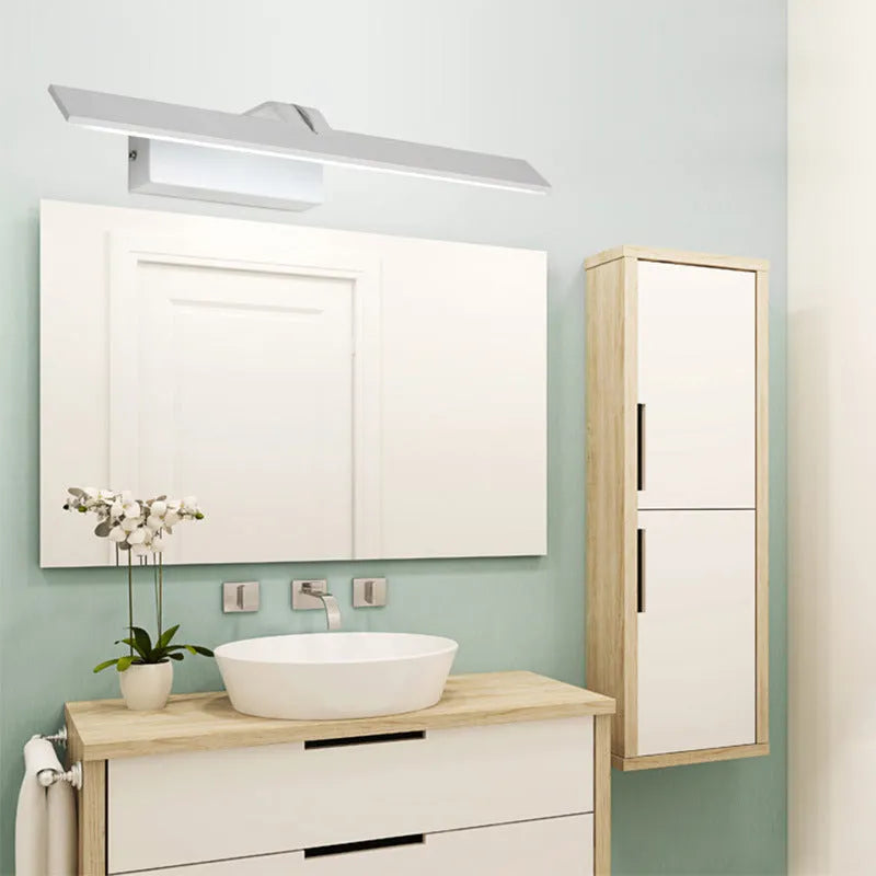 White LED bathroom mirror with tri-colour dimmable lighting mounted on a wall.